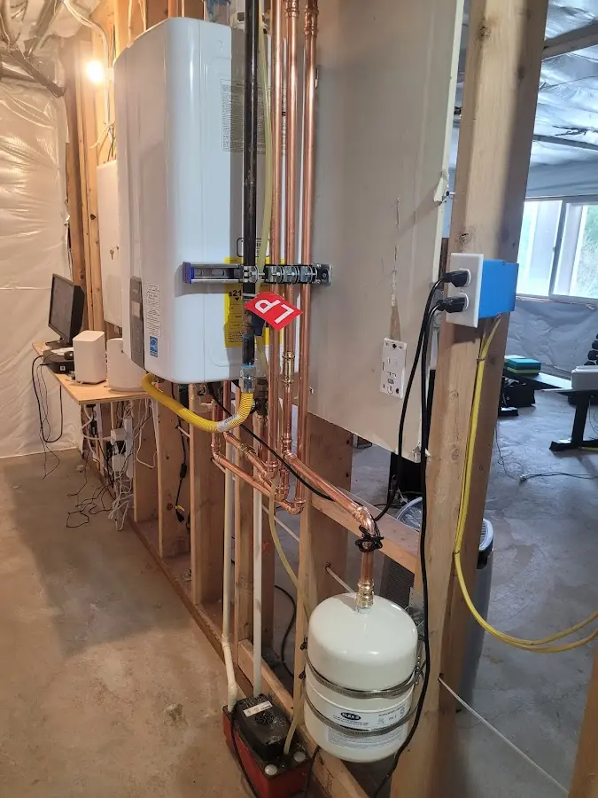 Licensed plumber repairing a kitchen sink in Blair
